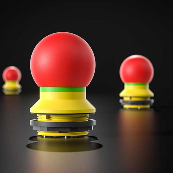 In the picture you can see an emergency stop with a round head.