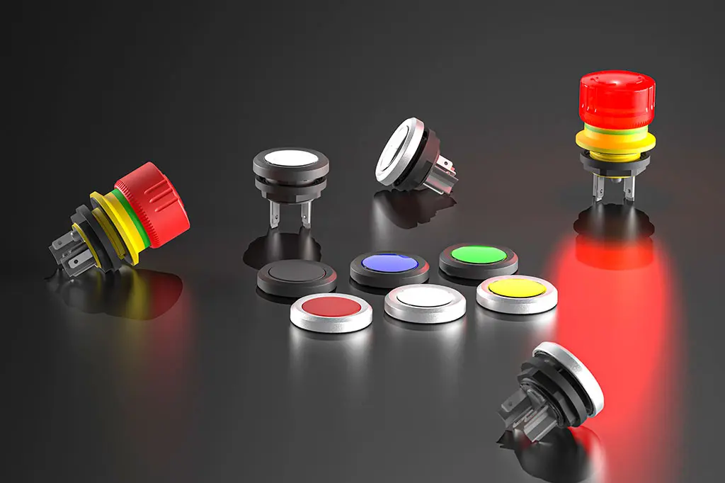 Not-Halt-Taster, Drucktasten, Schlüsselschalter und Wahlschalter auf einer schwarz-spiegelnden Oberfläche. Manche Taster liegen, andere stehen.